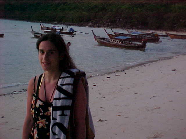 Natalie on beach in front of cabana